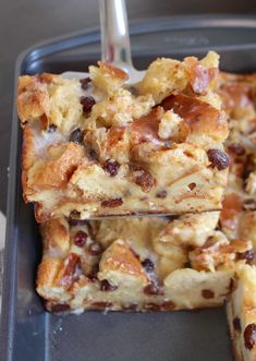 a close up of food on a pan with a fork in it and one slice missing