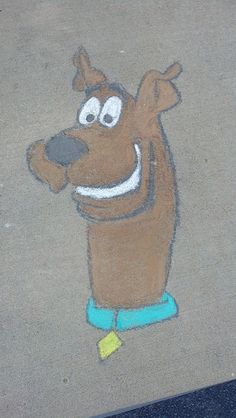 a drawing of a dog on the sidewalk