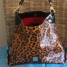 Women's Large Dooney & Bourke Purse/Tote. Lots Of Compliments When Wearing It! Animal Print With Red Lining. Dooney Bourke Handbags Tote Bags, Dooney Bourke Ostrich Handbags, Everyday Purse Dooney & Bourke, Hobo Purses Dooney & Bourke, Leather Crossbody Purse Dooney & Bourke, Dooney & Bourke Bags, Dooney Bourke, Bags Women