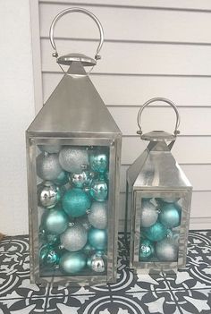 two glass containers with ornaments inside on a tile floor