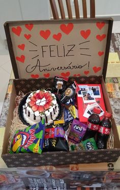 a box filled with assorted candy and candies sitting on top of a table