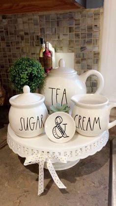 tea and sugar set sitting on top of a table