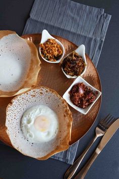 a plate with eggs and other foods on it