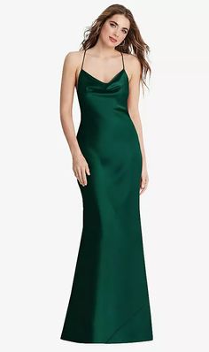 a woman in a long green dress