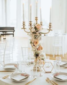 a table set with flowers and candles for a wedding reception at the grand america hotel