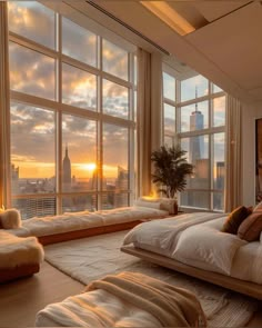 a bedroom with large windows and floor to ceiling windows that overlook the cityscape