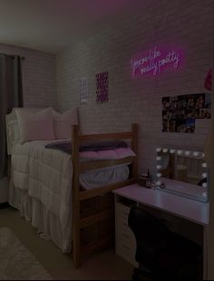 a bedroom with white brick walls and pink lights on the wall above the bunk bed