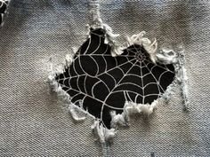 the fabric has been torn off and is black with white spider webs on it