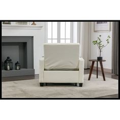 a white chair sitting in front of a fire place