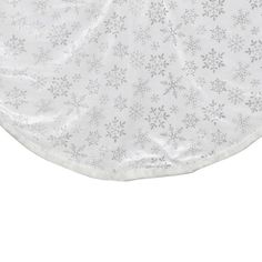 a white sheet with snowflakes on it and the bottom half is folded up