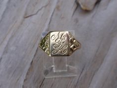 Victorian 10k yellow gold signet ring.  This sweet lady weighs 2.6g, is a size 6 1/4 & measures 10mm at the highest point front center.  She is engraved with cursive initials M F K along a pretty designs along the sides.  All items are in previously loved, used condition so please review all photos closely and let me know if you have any questions prior to purchasing. I'm not a jeweler or gemologist & I pass on all information available to me. As always, I offer free USPS Ground Advantage (formerly called First Class) shipping with tracking to US. And yes! We accept layaway payment plans. RETURN POLICY: I DO accept returns as I want all of these sweet treasures to find happy new homes and I will accept a return if I am notified within 3 days of the USPS delivery confirmation & the item is 14k Gold Engraved Ring With Initials For Collectors, Personalized Engraved Yellow Gold Ring For Collectors, Collectible Yellow Gold Engraved Ring With Hallmarks, Collectible Engraved Yellow Gold Ring With Hallmarks, Gold Signet Ring With Maker's Mark As Gift, Personalized Yellow Gold Signet Ring Collectible, 14k Gold Signet Ring With Maker's Mark As Gift, 14k Gold Engraved Ring With Maker's Mark As Gift, Heirloom 14k Gold Engraved Ring With Hallmark