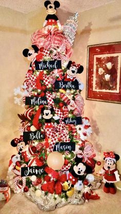 a christmas tree decorated with mickey and minnie mouses