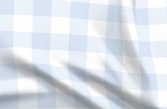 a blue and white checkered fabric is shown