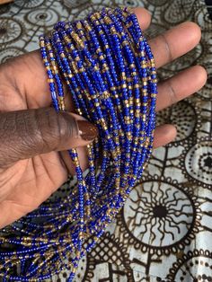 In Ghana we wear waist beads as a symbol of femininity. These playful beads can be wore over or under clothing. Traditionally they are worn on the "high hips" (think where your underwear sits) but can be worn where ever you feel the most beautiful! Wear a single strand or layer them! Each strand is sold individually even if pictured with others. Beads are safe to wear while bathing, sleeping, dancing and exercising. because they are on a cotton thread they will weaken and break over time. Add a Cheap Blue Waist Beads With Spacer Beads, Bohemian Waist Beads For Beach, Bohemian Style Colorful Waist Beads, Beach Waist Beads With Tiny Beads, Colorful Waist Beads For The Beach, Blue Round Beads Waist Beads For Gift, Blue Waist Beads Gift, Gold Beaded Waist Chain, Beach Waist Beads With Gold Beads