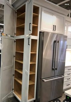 a refrigerator and some cabinets in a store