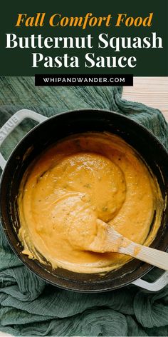 butternut squash pasta sauce in a skillet with a wooden spoon