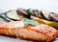 grilled salmon and vegetables on a white plate