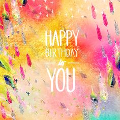 the words happy birthday written in white on a multicolored background with lots of feathers