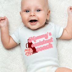 Grab this fun cheer baby bodysuit to announce your pregnancy, give at that next baby shower, or to just wear everyday! Made specifically with the coach's kid in mind, these bodysuits will remind the coach how much they are loved.  ⚜️Care Instructions:          - Turn bodysuit inside out and wash on cold          - Tumble dry on low temperature          - Do not iron directly on the lettering FOLLOW US Pinterest: @thegamedayfamily Instagram: @thegamedayfamily >>Thanks for your support of our shop Cheerleading Coach, Cheer Coach Gifts, Cheer Coach, Cheer Coaches, Selling Handmade Items, Going Home Outfit, Coach Gift, Sports Mom, Coach Gifts