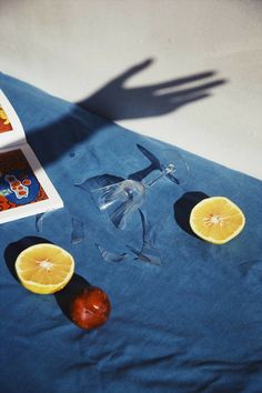 two slices of lemon sitting on top of a blue table cloth