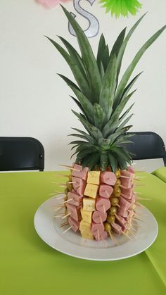 a pineapple with ham and cheese on it