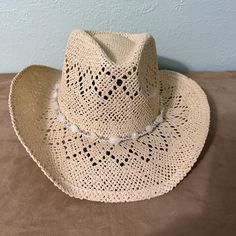 Off White Straw Cowboy Hat with Unique Woven Designs and White Beaded Hat Band This is a very fun hat to have in your wardrobe. It will go with jeans/dress and boots for a fun day or for a night on the town. Size: OSFA-Unisex (Head measurement: 58cm, 22-3/4", size 7-18) Brim: 3-1/8" Height: 4-3/4" Color: White Cowboy Hut, Fun Hat, Straw Cowboy Hat, Chapeau Cowboy, Beaded Hat, Cow Boy, Cool Hats, Hat Band, Cowboy Hat