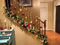 christmas decorations on the bannister and stairs