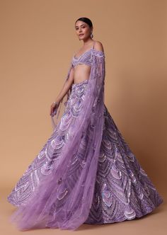 Lavender Pearl Embellished Lehenga with Off-Shoulder Draped Cape Elegant Purple Sets With Intricate Embroidery, Elegant Lavender Festive Sets, Elegant Lavender Sets For Festive Occasions, Elegant Festive Lavender Sets, Elegant Purple Reception Sets, Elegant Hand Embellished Purple Sets, Elegant Purple Sets With Sheer Dupatta, Elegant Lavender Sets With Sheer Dupatta, Elegant Purple Lehenga With Dupatta