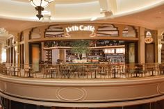 the inside of a restaurant with tables and chairs in it's center circle area