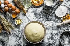 an assortment of baking ingredients and utensils on a table