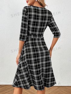 Stay stylish and classic with our Plaid Belted Dress for women. The chic design and timeless plaid pattern offer a versatile and elegant look for any occasion. The included belt accentuates your curves for a flattering fit. Perfect for the fashionable woman who values both sophistication and comfort. Color : Black and White Style : Elegant, Casual Details : Belted, Zipper Type : A Line Pattern Type : Plaid Neckline : Round Neck Sleeve Length : Half Sleeve Sleeve Type : Regular Sleeve Waist Line : High Waist Hem Shaped : Flared Length : Knee Length Fit Type : Slim Fit Fabric : Slight Stretch Material : Knitted Fabric Composition : 95% Polyester, 5% Elastane Care Instructions : Machine wash or professional dry clean Sheer : No Size US Belt Length Bicep Length Bust Cuff Hip Size Length Should Fall Fitted Knee-length Plaid Dress, Chic Knee-length Plaid Dress, Plaid Knee-length Office Dress, Classic Knee-length Plaid Dress, Fitted Gingham Plaid Knee-length Dress, Strapless Floral Dress, Belt Length, Line Pattern, Button Front Dress