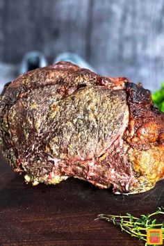 a piece of meat sitting on top of a wooden cutting board