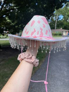 Pink cowprint cowboy hat with silver rhinestone fringe and pink string Western Silver Hats For Summer, Silver Summer Hat For Rodeo, Silver Summer Rodeo Hat, Western Style Adjustable Hat With Rhinestone Fringe, Adjustable Festival Hats With Rhinestone Fringe, Adjustable Rhinestone Fringe Hat For Festivals, Pink Cowgirl Outfit, Pink Cowgirl Aesthetic, Bach Themes