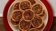 a plate full of pecan pies on a table