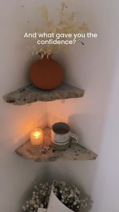 two shelves with candles and flowers on them