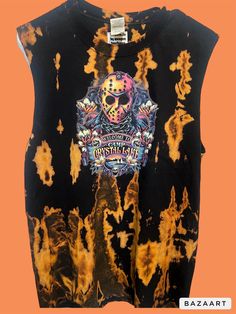 a black shirt with orange and yellow dye on it