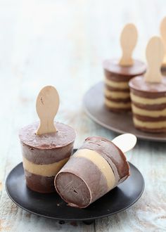 some desserts are sitting on plates and ready to be eaten