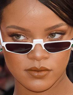 a close up of a person wearing sunglasses with an eye patch on their forehead and nose