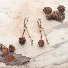 Length: 7 cm
 Pine cones covered with transparent resin
 Hook in antique brass, hypoallergenic
 Lightweight
 Very resistant and waterproof
 ^ SYMBOLS ^
 The pine cone provides greater mental clarity and spiritual elevation. Symbolizes the generating force. Spiritual Elevation, Mini Pine Cones, Italian Country, Pine Cone Art, Botanical Earrings, Resin Uses, Natural Jewelry, Tree Earrings, Brass Hook