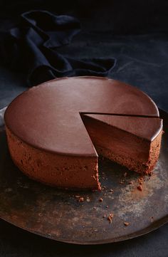 a chocolate cake with one slice missing from it