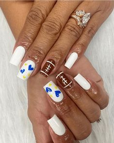 2024’s Trendiest Football Nail Designs – Show Your Team Spirit in Style Football Mom Nails Design, Team Color Nails, Football Nail Designs Nfl, Blue And Gold Football Nails, Fall Football Nail Designs, Team Spirit Nails, School Spirit Nails Designs, Blue Football Nails, Blue And Yellow Nail Ideas