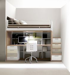 a loft bed with desk underneath it in a white walled room next to a wall