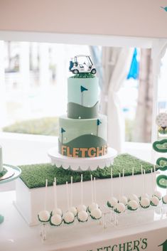 a golf themed wedding cake is displayed on a table