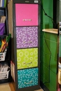 a tall cabinet with many different colored drawers