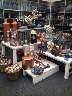 there are many vases and other items on display