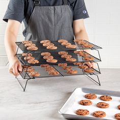 Cool batches of cookies or cakes with our Met Lux Black Iron Stackable Cooling Rack Set. Made from premium quality iron, this wire rack won't bend while holding large quantities of goods. With a corrosion-resistant coating, this 3-tier metal shelf will not be easily rusted, making it last a long time. The 3-tier design of this cooling tray set allows each rack to be stacked on top of each other to carry more food. This freezable baking rack set is easy to clean as it has a non-stick surface. Withstanding temperatures up to 392F, this metal rack set can be used in the oven to bake cookies or bread. With foldable legs, this cooling rack set for baking collapses down for efficient storage, and each rack can be taken out to fit inside a half-size sheet pan. This 3-tier wire shelf measures 15.7 Cooling Foods, Baking Rack, Drum Cake, Grill Presses, Concession Food, Wire Shelf, Sheet Cake Pan, Efficient Storage, Cooling Rack