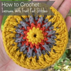 a hand holding a crochet pin cushion with text overlay reading how to crochet increase with front post stitches