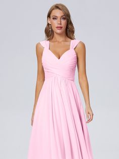 a woman wearing a pink bridesmaid dress