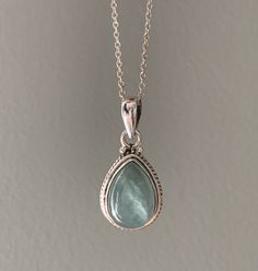 Sterling silver aquamarine necklace. Beautiful Aquamarine stones set in sterling silver. All stones are natural and therefore each one is unique. Aquamarine is a healing stone, a stone of courage used for reducing stress and calming the mind. Promotes self expression and increases sensitivity and highly protective during pregnancy. Boosts the immune system and a great meditation stone. Birthstone of March. Matching earrings available. Gift box available for purchase. Search GIFTBOX Silver Aquamarine Necklace, Aquamarine Necklace Vintage, Etsy Necklaces Unique, Silver Boho Earrings, Silver Teardrop Gemstone Birthstone Necklace, Silver Birthstone Teardrop Pendant Crystal Necklace, Silver Drop Necklace With Natural Stones For Gift, Blue Topaz Teardrop Pendant Gemstone Necklace, Sterling Silver Teardrop Gemstone Crystal Necklace