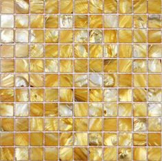 an abstract mosaic tile design in gold and white